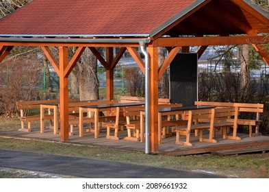 school classroom in nature in the garden. pergola under which are tables, chairs and blackboards. children are taught in the beautiful garden in the fresh air