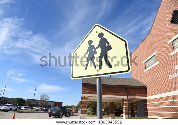School\
crossing sign focus with beautiful sky\
background
