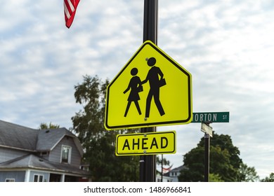 An School Crosswalk Ahead Traffic Sign In A Road