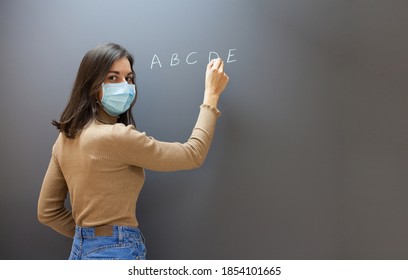 School During Covid Pandemics Female Teacher With Face Mask