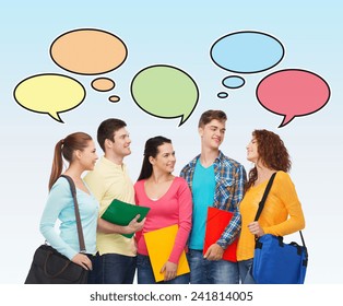 school, education, communication and people concept - group of smiling students with folders and school bags over blue background with text bubbles