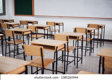 School empty classroom or lecture room interior with desks chair iron wooden whiteboard for studying lessons of secondary education in high school thailand. Learning and Back to school concept