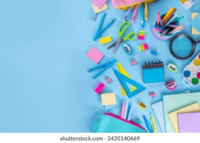 School equipment high-colored bright blue flat lay. Various school education and office supplies, accessories. Back to school sale background top view copy space - Powered by Shutterstock