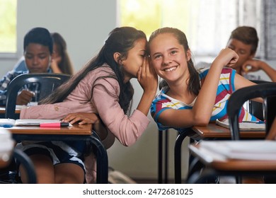 School, friends and whisper in classroom for secret, story and gossip together with hand by desk. Campus, students and girls talking in ear in class for news, info and chat with private discussion - Powered by Shutterstock