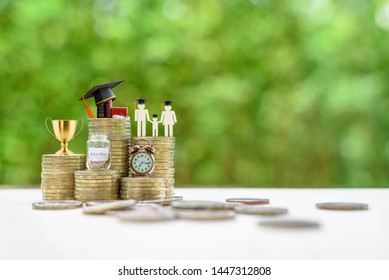 School Funding, Family Saving For Higher Education Concept : Black Graduation Cap, Campus Diploma, Money Jar, Trophy Cup Of Success Or Winner Reward, Clock On Rising Coins, Depicts Passage Of Success