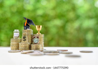 School funding, saving for higher education concept : Black graduation cap, campus diploma, US dollar bag, trophy cup of success or winner reward, a clock on rising coins, depicts passage of success
