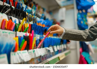 School girl choosing a pen in stationery store - Powered by Shutterstock