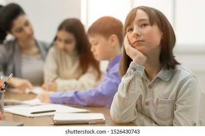 School Girl Dreaming, Not Paying Attention At Lesson, Teacher And Classmates On Background