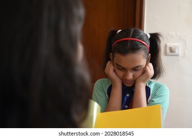 School Girl Is Holding Her Ears And Saying Sorry