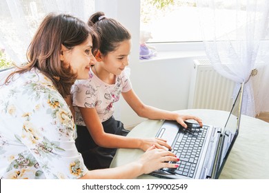 A School Girl At Home Performs Homework And Gets New Knowledge On The Internet, Classes On A Remote Program