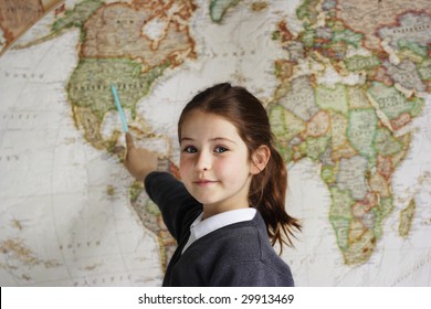 A School Girl Indicating The United States Of America On A World Map