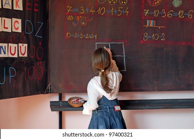 school girl on math classes finding solution and solving problems