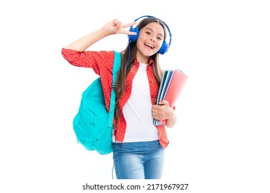 School girl, teenage student in headphones hold books on white isolated studio background. School and music education concept.