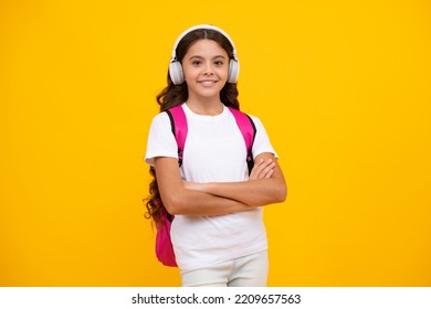 School Girl, Teenager Student In Headphones On Yellow Isolated Studio Background. School And Music Education Concept. Back To School.