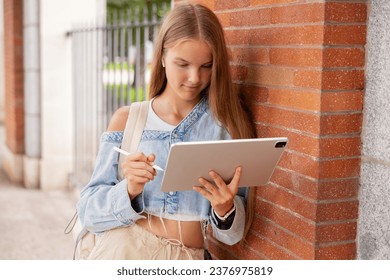 School girl using tablet computer