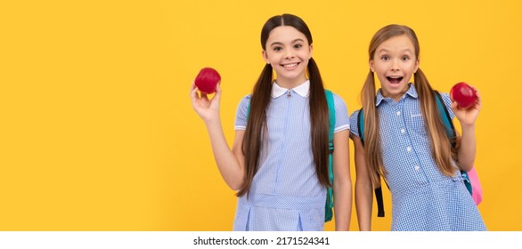 School Girls Friends. Happy Kids Hold Apples. School Nutrition. Food Education. Back To School Snack. Horizontal Isolated Poster Of School Girl Student. Banner Header Portrait Of Schoolgirl Copy Space