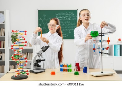 School Girls At Workplace In Chemistry Class