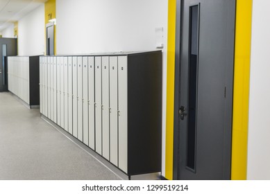 School interior, corridor with doors and lockers. Horizontal frame - Shutterstock ID 1299519214