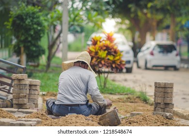 School Janitor Builds A Brick Pathway In School