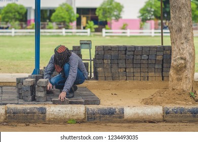 School Janitor Builds A Brick Pathway In School