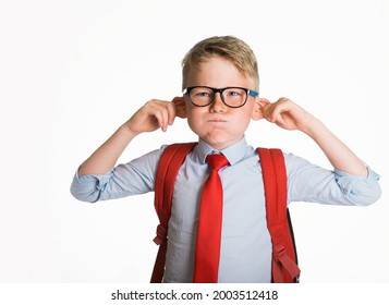 School Kid Boy Making Monkey Face. Funny Silly Child Boy Grimacing Isolated On White Background. Pupil With Big Ears Listening. Emotional Face Of Caucasian Blond Kid With Freckles Looking At Camera