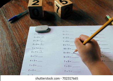 A School Kid Doing 1st Grade Math Homework.