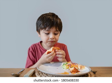 School Kid Eating Salmon Steak And Mixed Vegetables Salad For His Meal, Happy Child Having Healthy Lunch Or Dinnerat Home, Cute Boy Eating Organic Carrot, Sweet Bell And Chinese Cabbage