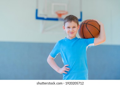 School Kid Playing Basketball In A Physical Education Lesson. Safe Back To School During Pandemic Concept