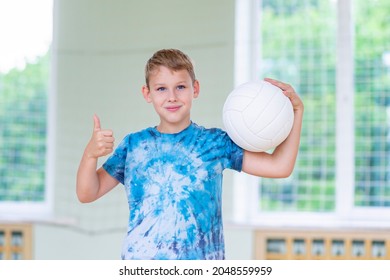 School kid playing volleyball in a physical education lesson. Horizontal education poster, greeting cards, headers, website.Safe back to school during pandemic concept - Powered by Shutterstock