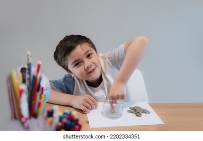 School Kid Putting Money Coins Into Clear Jar, Child Counting His Saving Money, Young Boy Holding Coin On His Hands, Children Learning About Saving For Future Concept