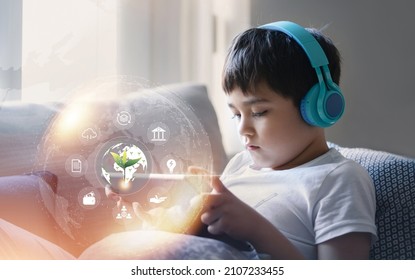 School Kid Using Tablet Research On Internet About World Population, Ecology And Environmental,Boy Doing Online Learning,Geography With Double Exposure Growth Futuristic Young Green Tree On Globe Map