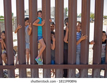 School Kids On The US To Mexico Border Wall In Sunland Park, New Mexico Enjoying Themselves, Sunland Park, New Mexico, August 18th, 2020.