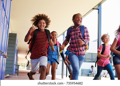 School Kids Running To Camera In School Hallway, Close Up