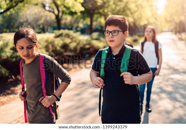 School Kids Wearing Backpack Going Together Stock Photo 1399243379 ...