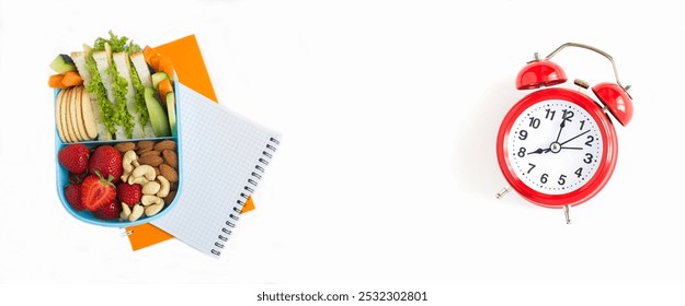 School lunch in the blue box, notebook and red alarm clock on the white background. Top view. Copy space. - Powered by Shutterstock