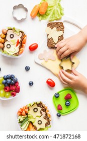 School Lunch Box For Kids On White Background. Back To School. Cooking. Child's Hands. Top View, Flat Lay