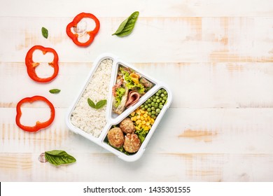 School Lunch Box With Tasty Food On White Wooden Table