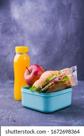 School Lunch, A Sandwich With Salad And Ham, Juice, Apple. Healthy Nutrition For Children. School Break. Free Space For Text. Copy Space.