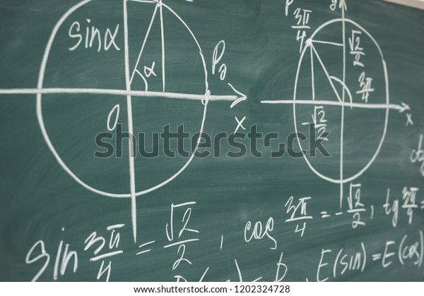 School math lesson. Trigonometry. Chalkboard\
Function graphs.