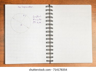 A school notebook with formulas
