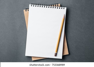 school notebook on a dark gray background, spiral notepad on a desk