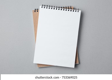 school notebook on a gray background, spiral notepad on a table