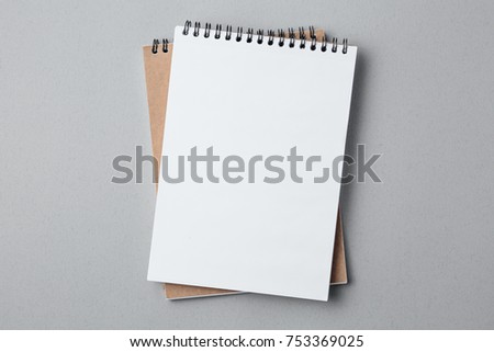 school notebook on a gray background, spiral notepad on a table