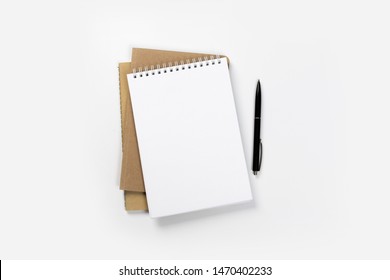 School Notebook On A White Background, Spiral Notepad On A Table. Flatlay