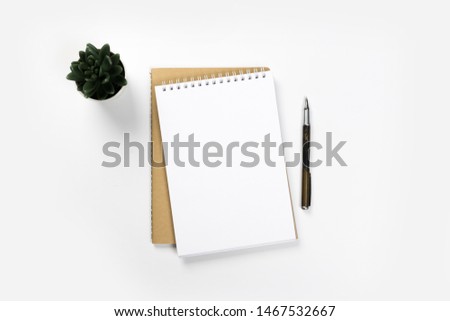 school notebook on a white background, spiral notepad on a table. flatlay