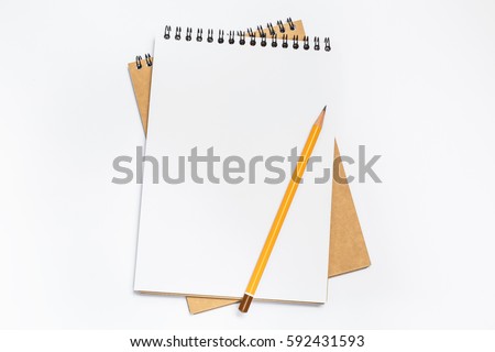 School notebook with pencil on table