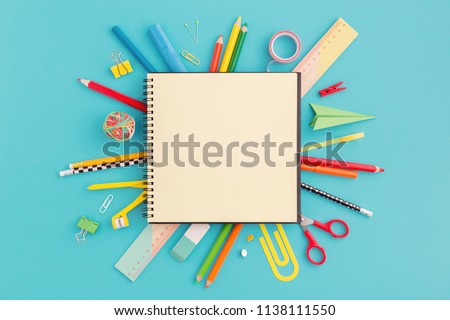 School notebook and various stationery. Back to school concept.