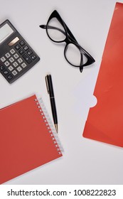 school objects, glasses, folder, notebook, calculator                               