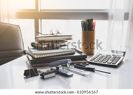 School and office stationary on white desk in office