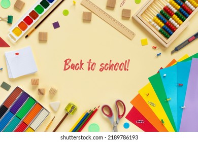 School And Office Supplies Border On Beige Paper Background. Multicolored Pencils, Paints, Plasticine, Abacus, Pushpins And Other School Accessories. Flat Lay  Top View With Copy Space. Back To School